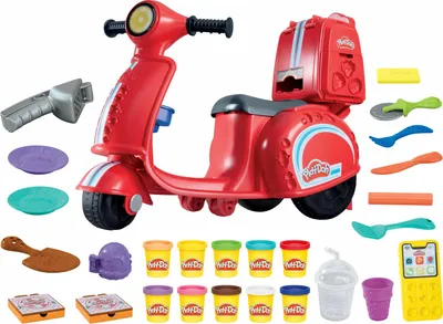 A collection of Play-Doh pizza-making accessories and tools arranged around a red toy scooter.