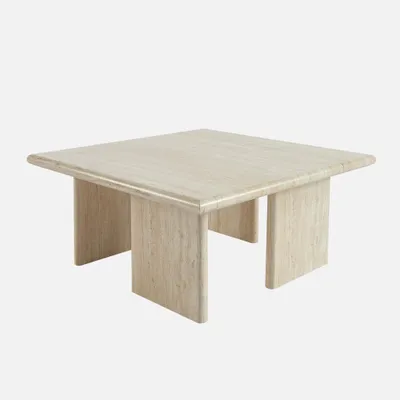 A square coffee table made of travertine-look material, presented against a plain white background.