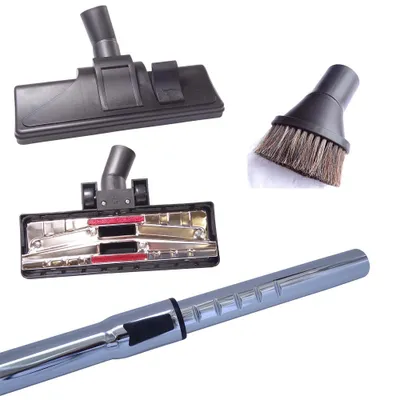 A collection of vacuum cleaner attachments and a section of the vacuum wand, displayed on a white background.