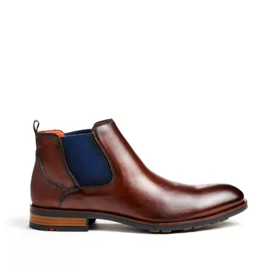A single brown leather Chelsea boot is shown against a white background.