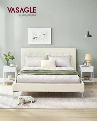 A bedroom scene featuring a bed and two nightstands.