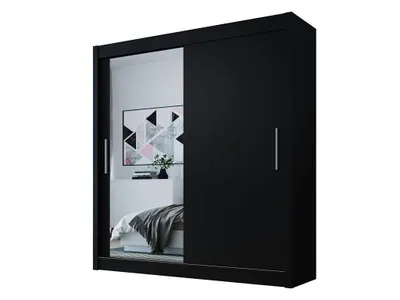 A black sliding door wardrobe with a mirrored door, reflecting a bedroom interior.