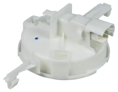 A white plastic component for a dishwasher.