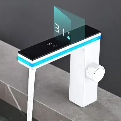 A modern white faucet with a black top displaying a digital temperature reading and blue LED lighting, with water flowing out.