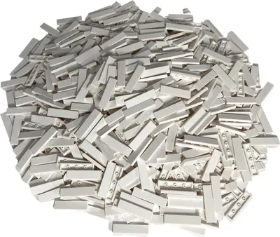 A pile of white LEGO® 1x4 tiles.