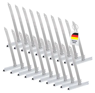 A group of metal rolladen suspension springs arranged diagonally on a white background, with a German flag tag attached to one of them.