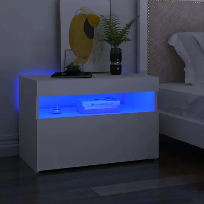 A white nightstand with blue LED lighting is shown next to a bed.