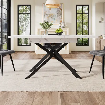 A dining room with a marble-top table and chairs.