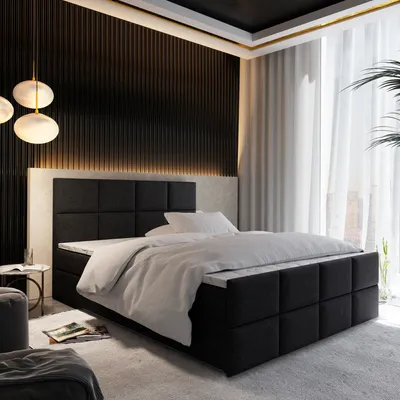 A modern bedroom with a large bed, decorative wall paneling, and ambient lighting.