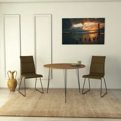 A dining set with a table and two chairs in a room with a painting on the wall.