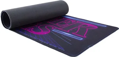 A mousepad with a Stranger Things arcade design, partially unrolled.