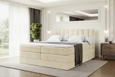 A bedroom scene with a large bed as the focal point.