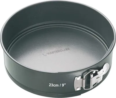 A round springform cake pan with a removable side and a clamp closure.