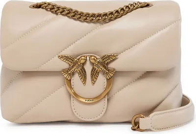 A beige leather handbag with gold hardware.