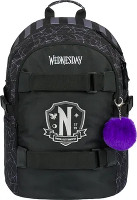 A black backpack with a purple pom-pom keychain.