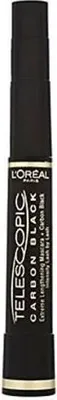 A black mascara tube with gold accents and text.