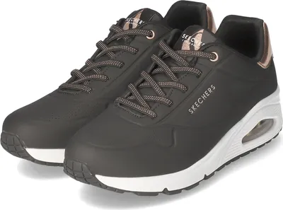 A pair of black Skechers Uno sneakers with white soles and rose gold accents.