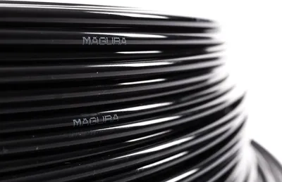 A close-up, coiled black hose with the brand name 'MAGURA' visible on it.