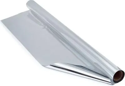 A roll of silver cellophane film on a cardboard tube, partially unrolled.