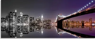 Produktbild von ARTland Glasbild New York Skyline nächtliche Reflektion Größe: 125x50 cm