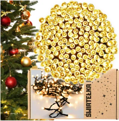 A Christmas tree with ornaments and a box of LED string lights.