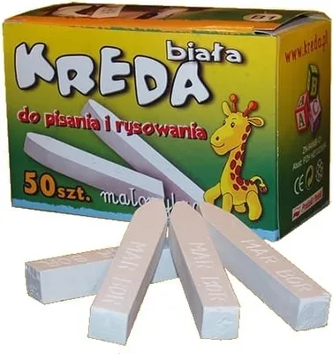 A box of white chalk with several pieces of chalk in front of it.