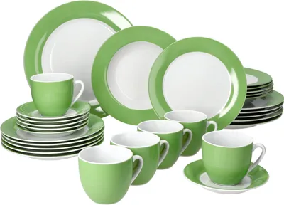 A set of green and white porcelain dinnerware and cups arranged on a white background.