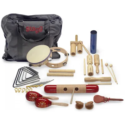 A collection of percussion instruments laid out on a white background, with a black carrying bag in the background.