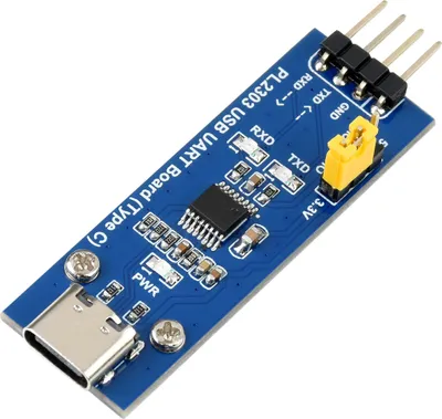 A blue electronic circuit board with various components and labels, including a USB-C connector and pins.