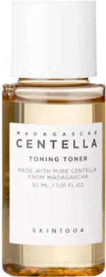 A close-up studio shot of a small bottle of skincare toner.