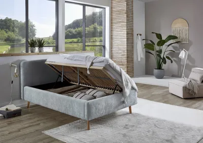 Produktbild von Meise Möbel Stauraumbett Mattis 120x200 cm | Bettkasten & Lattenrost (Federholzrahmen) | Strukturstoff Hellblau | Holzfuß eichefarbig