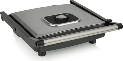 A close-up, angled view of a closed contact grill on a white background.