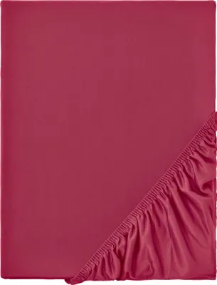 A close-up of a folded red fitted sheet, showing the elasticated edge.