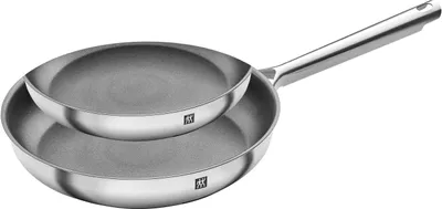 Two stainless steel frying pans stacked on top of each other against a white background.