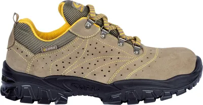 A side view of a tan work shoe with yellow accents and a black sole.