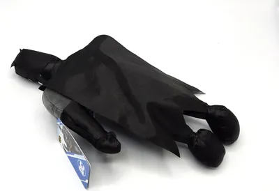 A Batman plush toy lying on a white background.