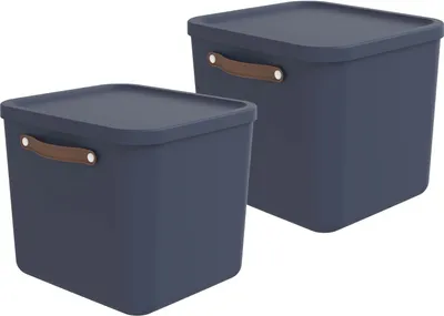 Two dark blue storage boxes with brown handles are shown against a white background.