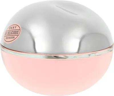 A close-up shot of a round, pink and silver perfume bottle.