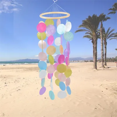 Image de Mobile éolienne décorative avec des coquillages nacrés, décoration bohème faite à la main, ornement pour fenêtre