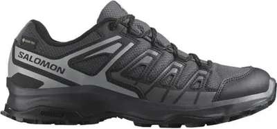 A side view of a single Salomon shoe against a white background.