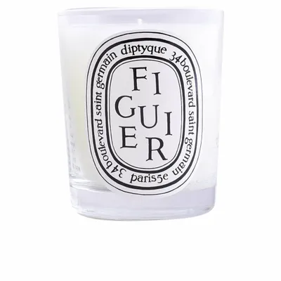 A close-up studio shot of a Diptyque scented candle in a glass jar.
