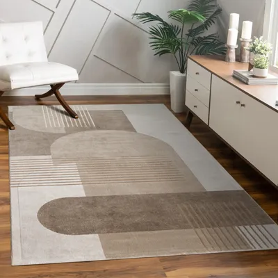A living room scene with a rug, chair, and cabinet.