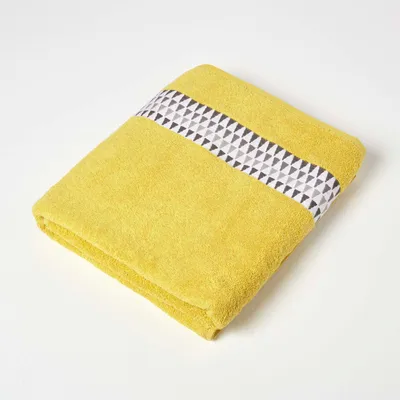 Image de HOMESCAPES Serviette de bain avec bordure avec motif triangulaire 100% coton Serviette 100x150cm - jaune moutarde