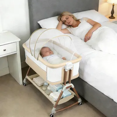 Produktbild von Babywiege & Beistellbett - 6-fach höhenverstellbar - Atmungsaktive Matratze - Belüftungsfenster - Schaukelmodus - Schiebesystem - 0–12 Monate - Beige