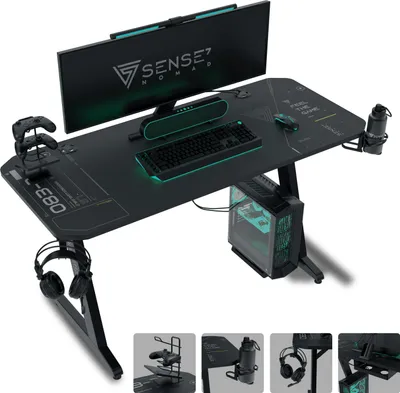 A gaming desk setup with a monitor, keyboard, mouse, computer tower, and accessories.
