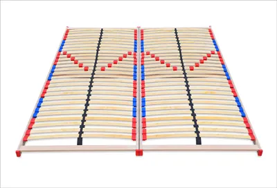 A wooden bed frame base with flexible slats and colored caps.