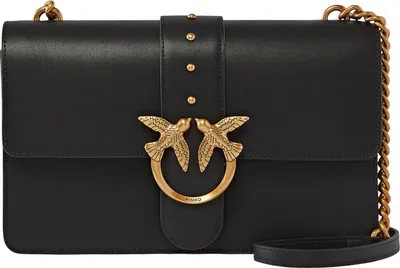 A black leather handbag with gold hardware is shown against a white background.