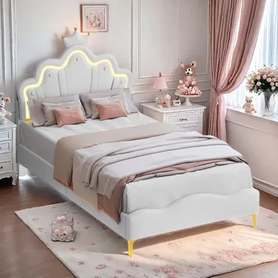 A child's bedroom with a white bed, pink accents, and decorative elements.