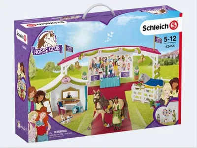 The image shows the packaging for a Schleich Horse Club toy set, depicting a large horse show scene with various figures and accessories.