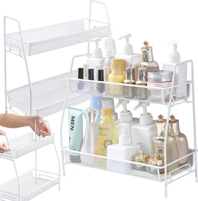 A white two-tier bathroom shelf filled with various cosmetic and personal care products.